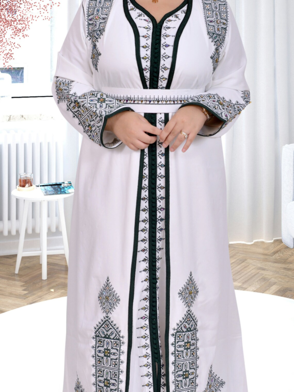 Elegant white kaftan dress with green traditional design