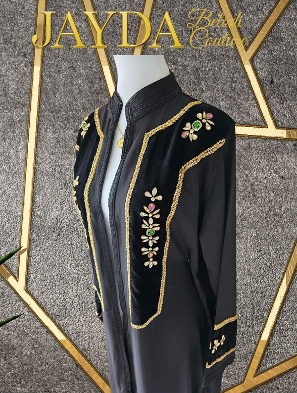 Black kimono dress featuring intricate beadwork and a sophisticated elegant finish.