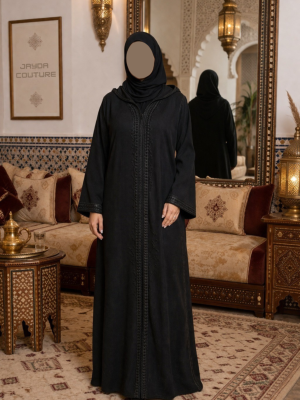 Simple black djellaba with elegant minimal design and refined traditional style.